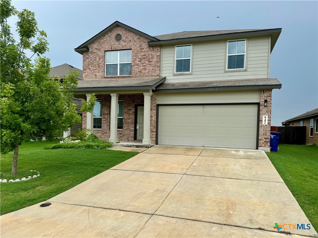 942 Pumpkin Ridge New Braunfels, TX 78130 - Photo 2 of 18 a front view of a house with garden