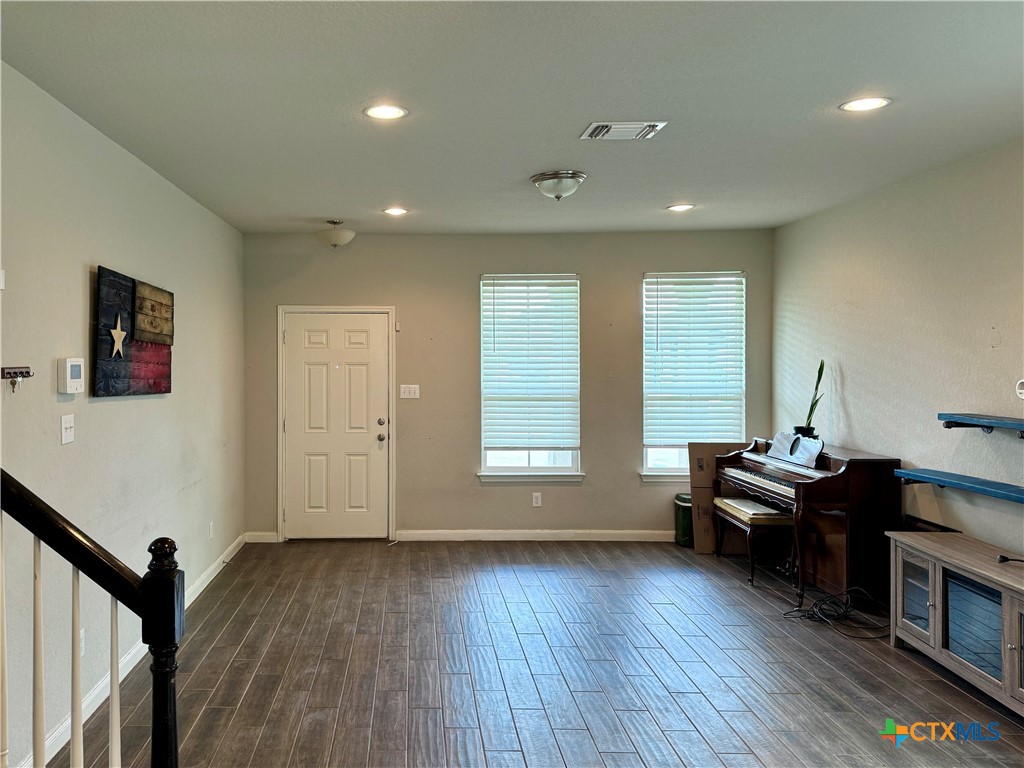942 Pumpkin Ridge New Braunfels, TX 78130 - Photo 6 of 18 a living room with furniture and wooden floor