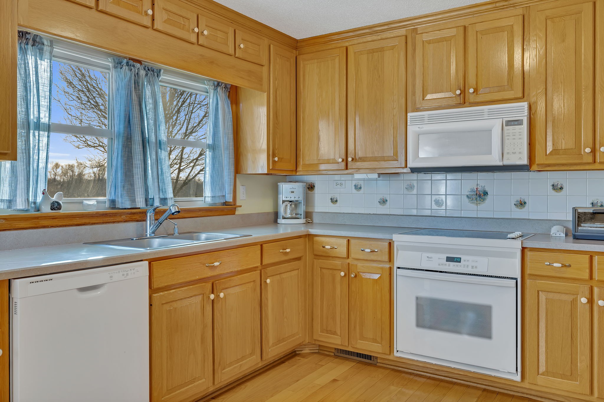 157 Vanntown Road Flintville, TN 37335 - Photo 8 of 30 a kitchen with stainless steel appliances granite countertop a sink and cabinets with wooden floor
