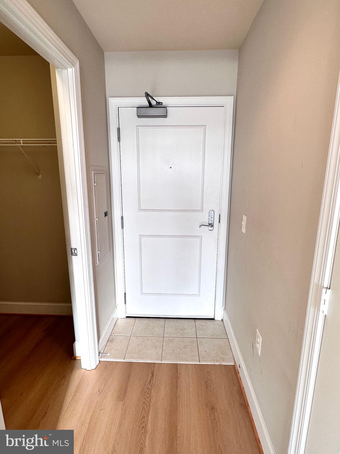 3600 South Glebe Road, Unit 507W Arlington, VA 22202 - Photo 7 of 23 a view of empty room with wooden floor and cabinet