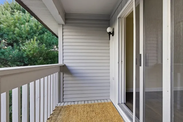 a view of balcony with wooden floor