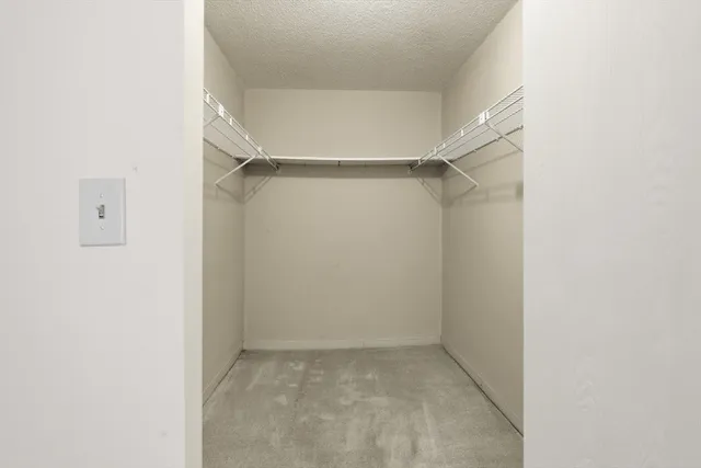 a view of an empty walk in closet