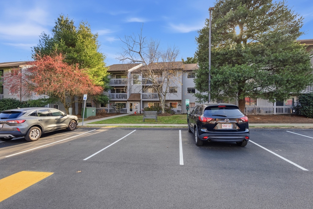 2211 Franklin Crossing Road, Unit 2211 Franklin, MA 02038 - Photo 2 of 32 a car parked in front of a house