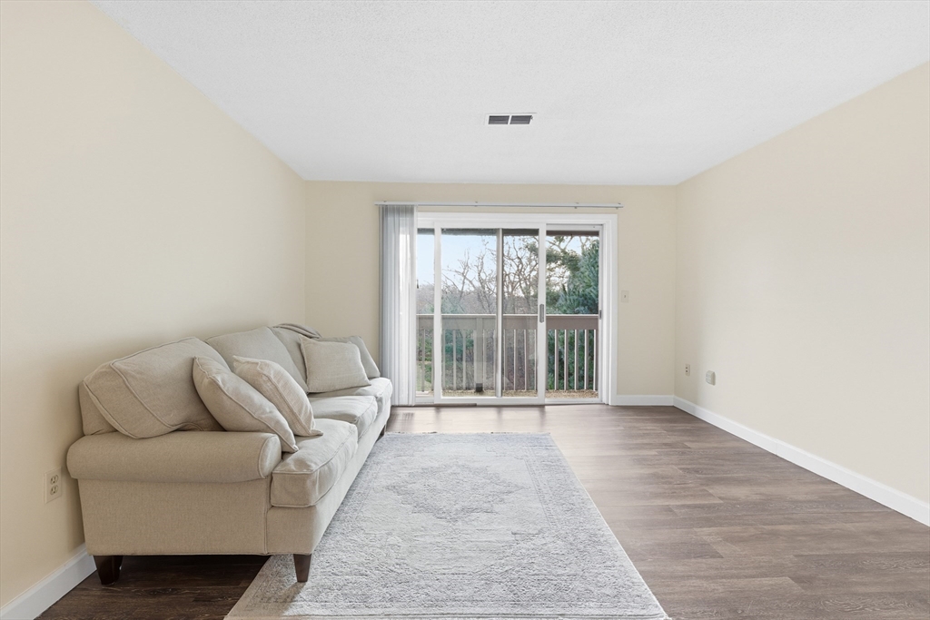 2211 Franklin Crossing Road, Unit 2211 Franklin, MA 02038 - Photo 3 of 32 a living room with furniture and a large window