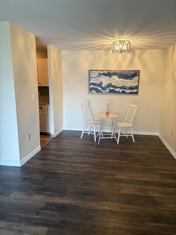 2211 Franklin Crossing Road, Unit 2211 Franklin, MA 02038 - Photo 5 of 32 a view of a dining room with furniture and wooden floor