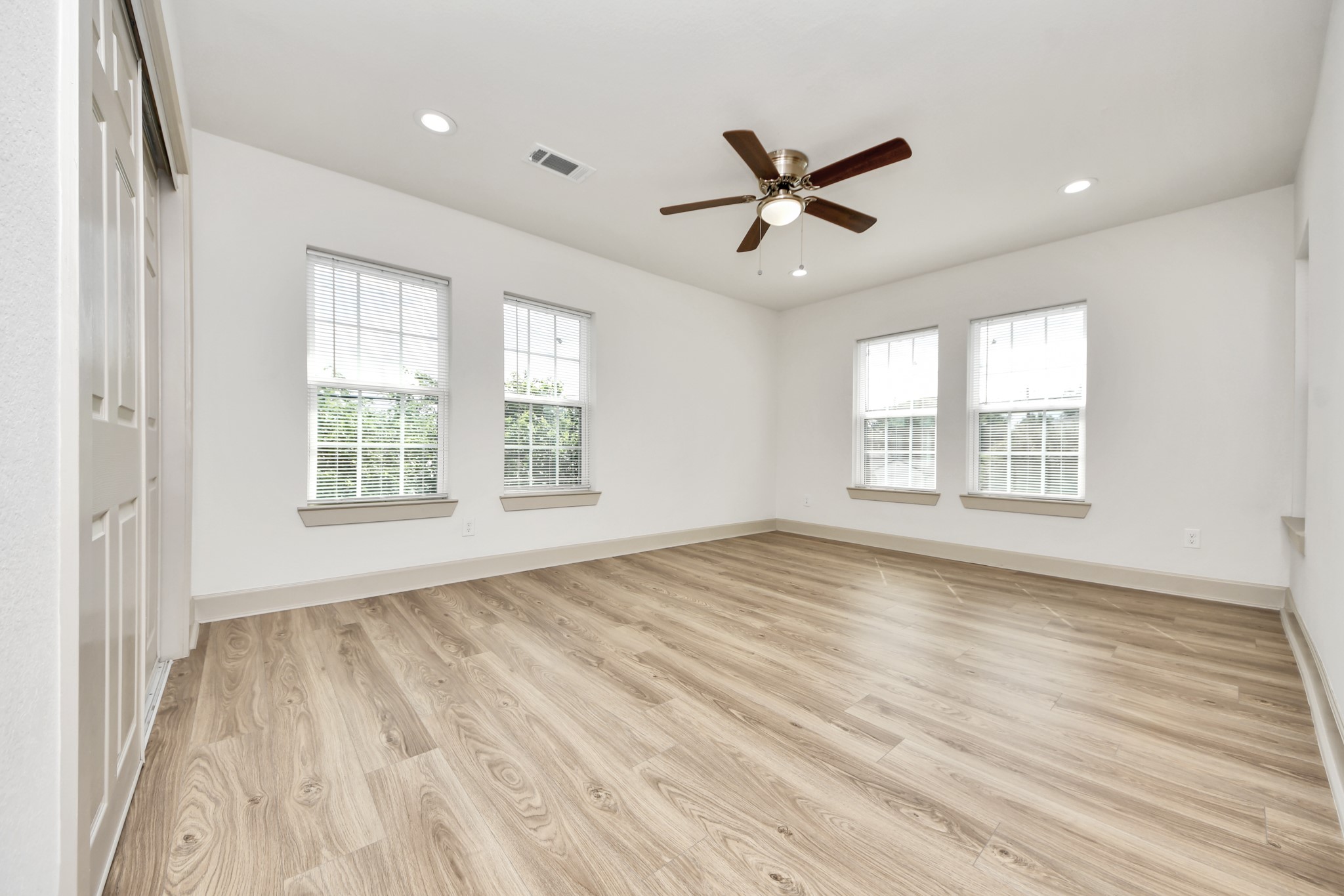 2919 Rosedale Street, Unit B Houston, TX 77004 - Photo 26 of 35 a view of an empty room with a window and wooden floor