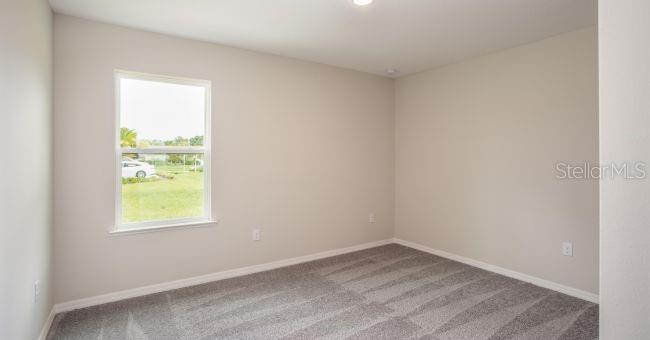5268 Hanford Avenue Spring Hill, FL 34608 - Photo 14 of 14 an empty room with a window