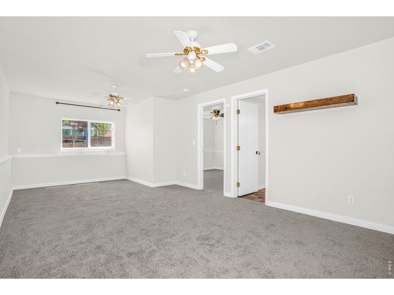 526 East 23rd Street Road Greeley, CO 80631 - Photo 3 of 20 a view of an empty room with a window