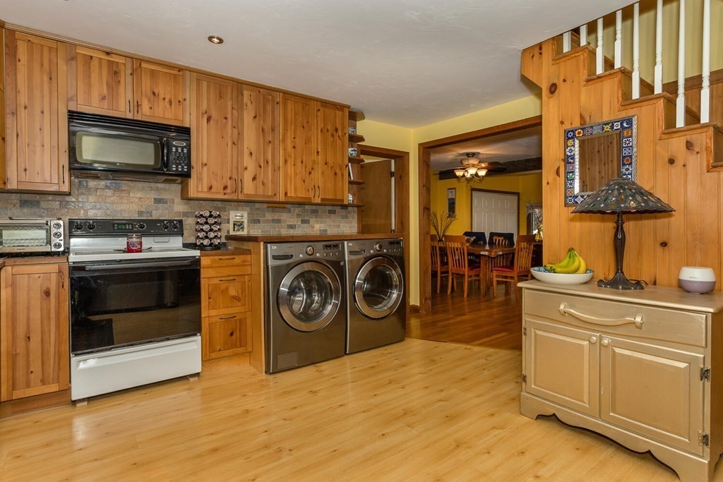 49 Pleasant Circle Canton, MA 02021 - Photo 12 of 25 a kitchen with stainless steel appliances granite countertop a stove and a sink