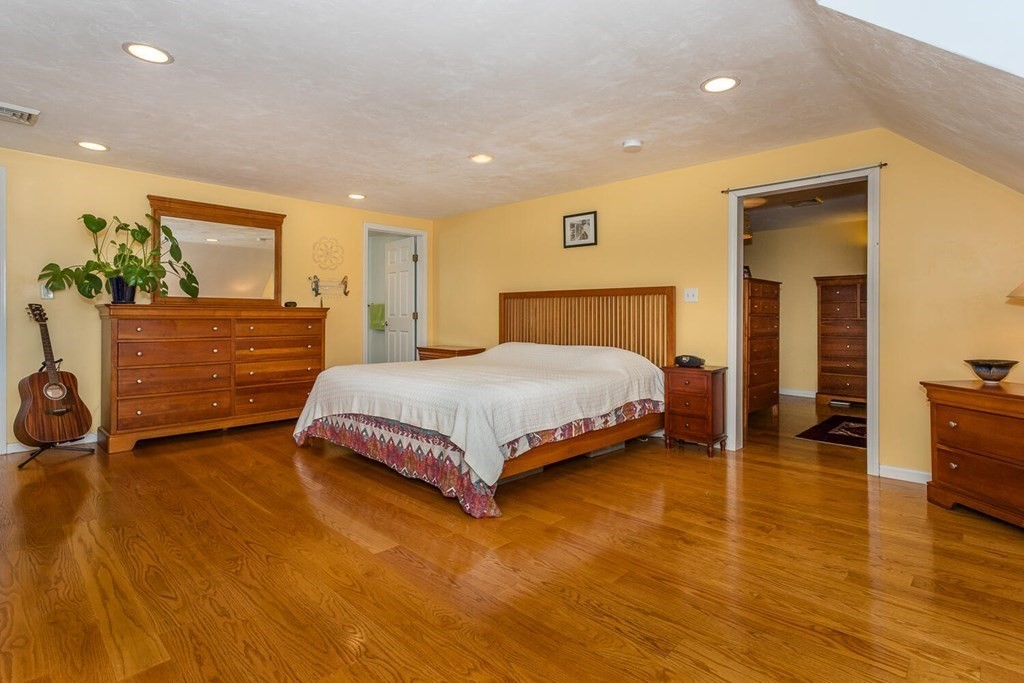 49 Pleasant Circle Canton, MA 02021 - Photo 15 of 25 a bedroom with a bed and wooden floor