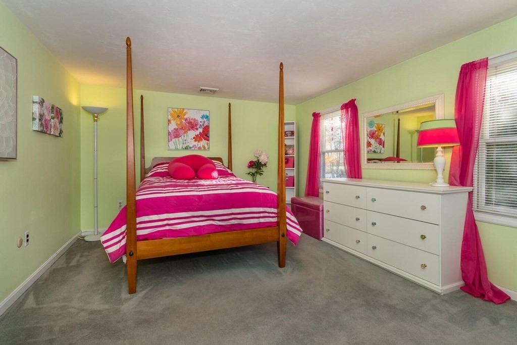 49 Pleasant Circle Canton, MA 02021 - Photo 19 of 25 a bedroom with a bed and a dresser
