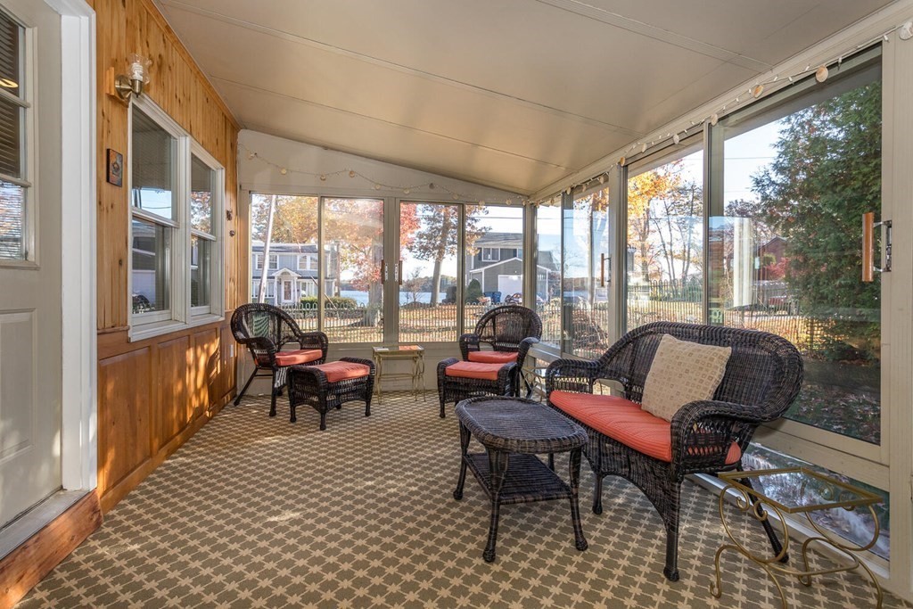 49 Pleasant Circle Canton, MA 02021 - Photo 21 of 25 a living room with furniture and a floor to ceiling window