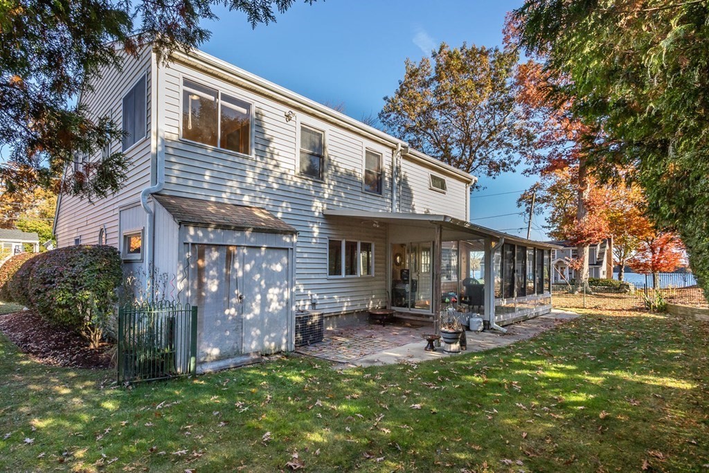 49 Pleasant Circle Canton, MA 02021 - Photo 22 of 25 a view of a house with a yard