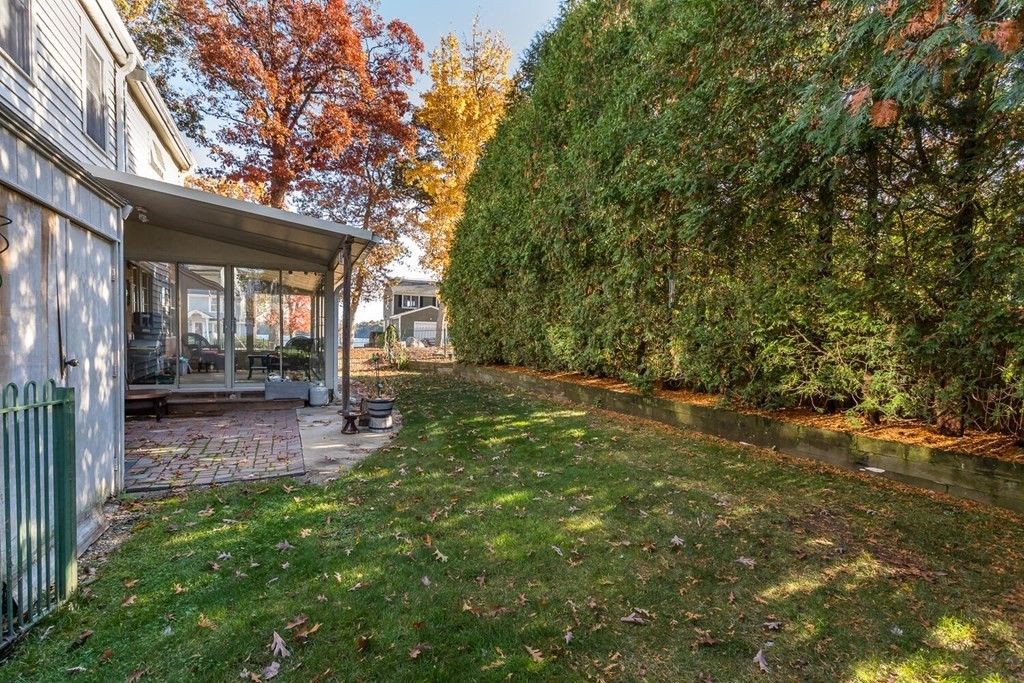 49 Pleasant Circle Canton, MA 02021 - Photo 23 of 25 a view of backyard of house with green space