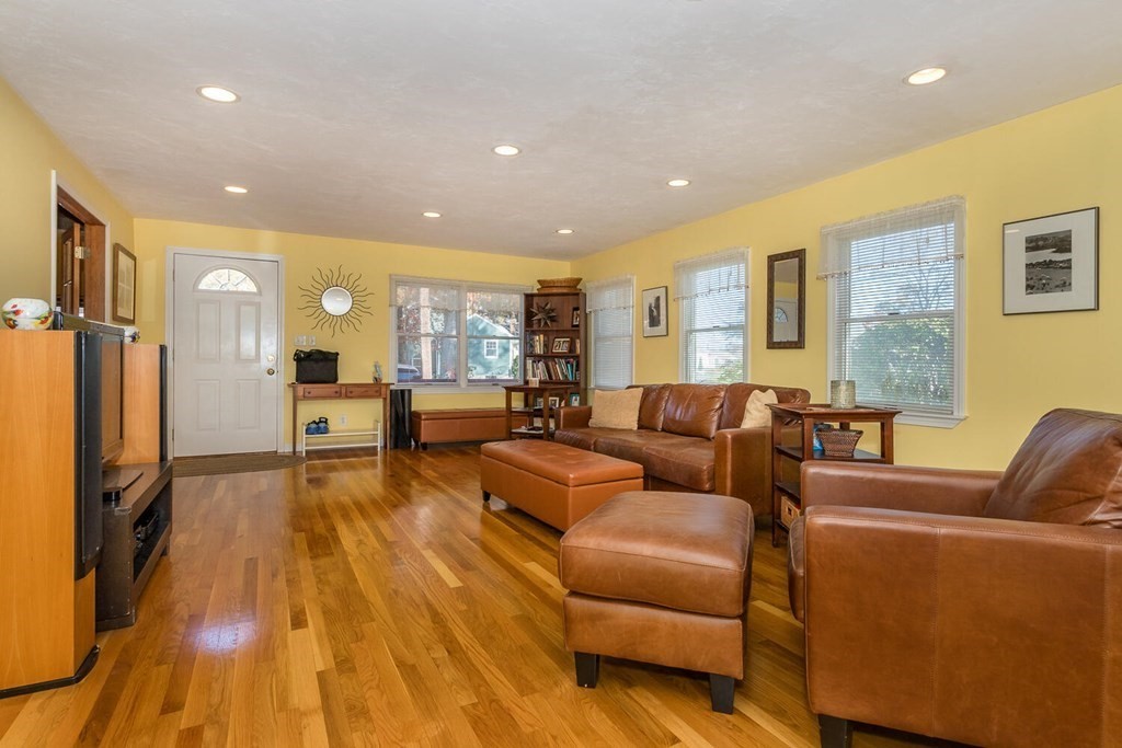 49 Pleasant Circle Canton, MA 02021 - Photo 6 of 25 a living room with furniture and a wooden floor