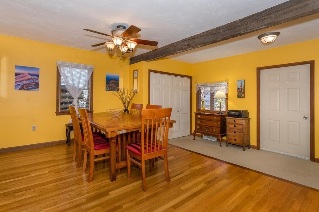 49 Pleasant Circle Canton, MA 02021 - Photo 9 of 25 a view of a dining room with furniture and a chandelier