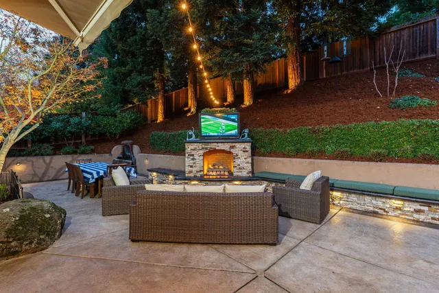 a view of a patio with table and chairs and potted plants