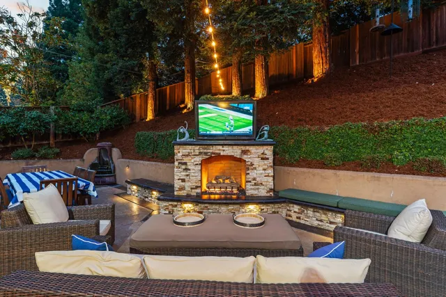 a view of a backyard with furniture and a slide
