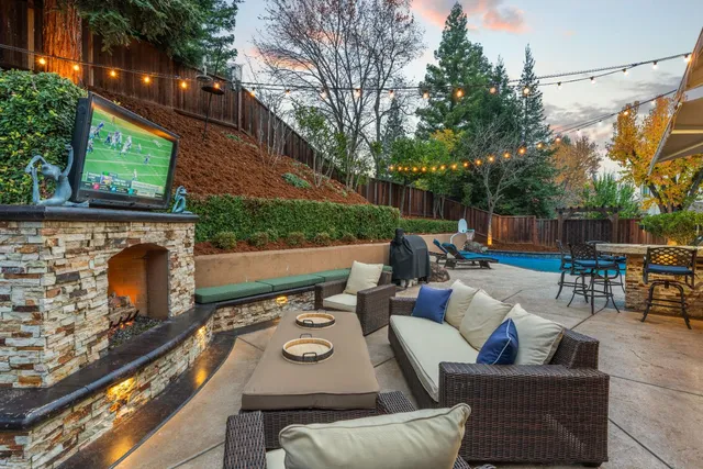 a view of a backyard with sitting area