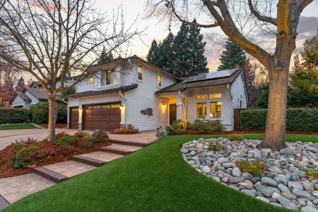 a front view of a house with garden