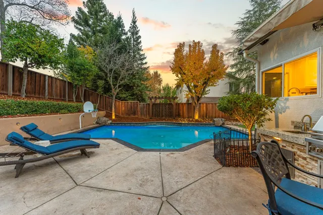 a view of a a dining room with furniture window and wooden floor
