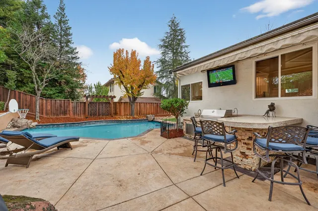 a bedroom with a bed and a flat screen television