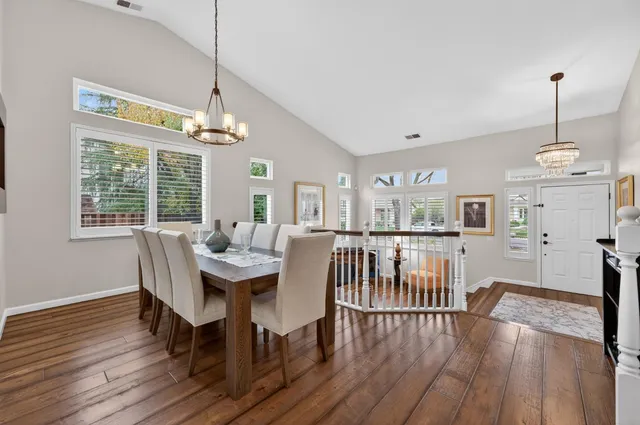 a bathroom with a granite countertop sink a toilet and a mirror