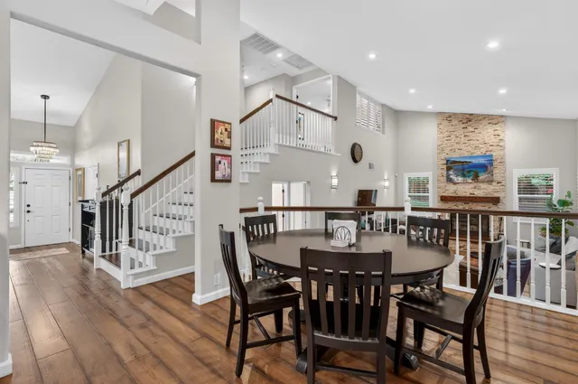 a kitchen with stainless steel appliances granite countertop a refrigerator and cabinets