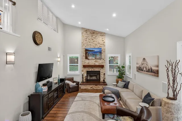 an aerial view of a house with a garden and a yard