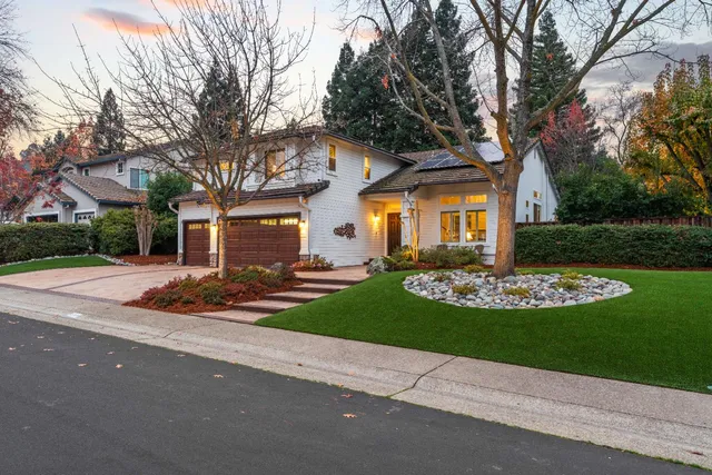 front view of a house with a garden