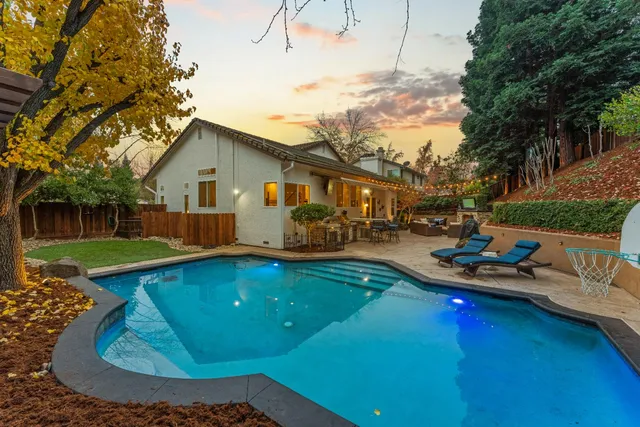 a view of a patio with couches and a fire pit