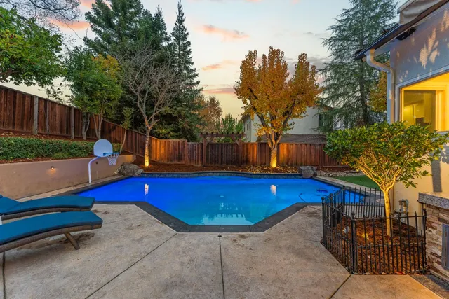 a outdoor living space with patio furniture and a fireplace