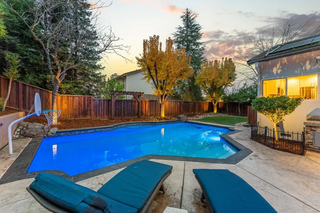 a backyard of a house with outdoor seating