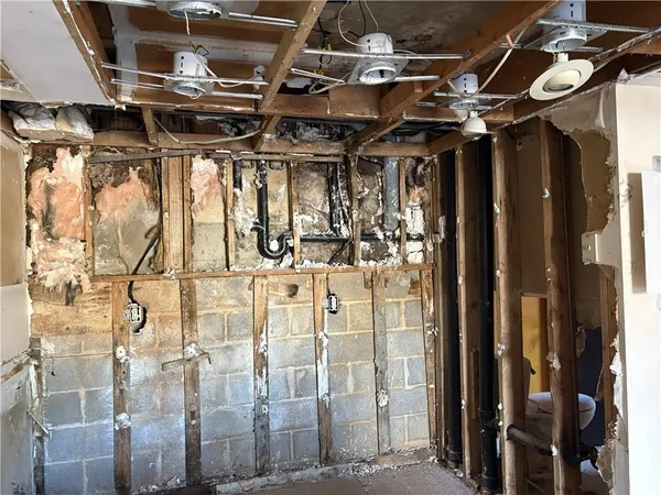 a view of a room with wooden walls