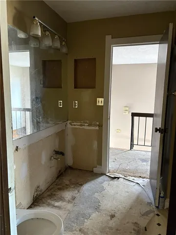 a bathroom with a sink and mirror