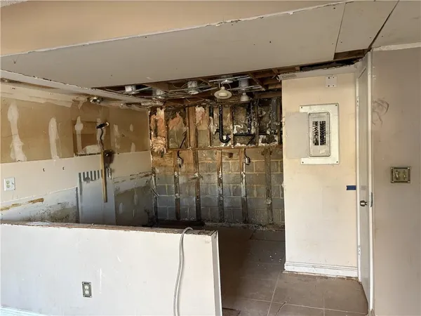 a view of a refrigerator in a kitchen