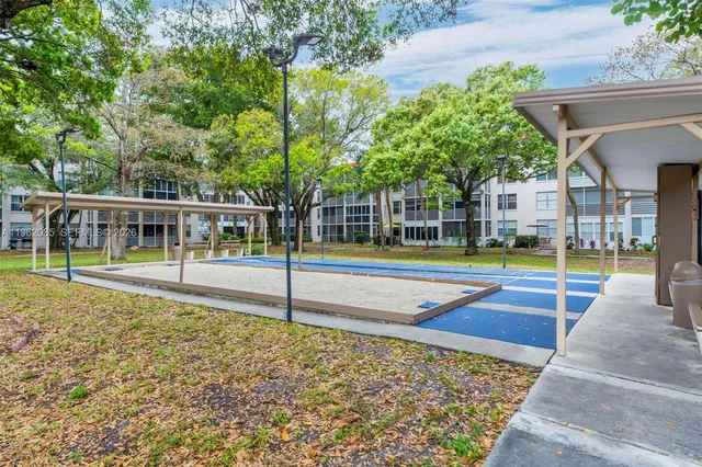 a view of a building with a yard