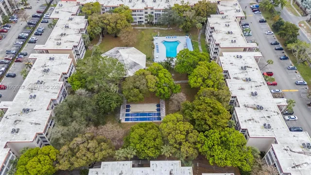 an aerial view of a house with a swimming pool