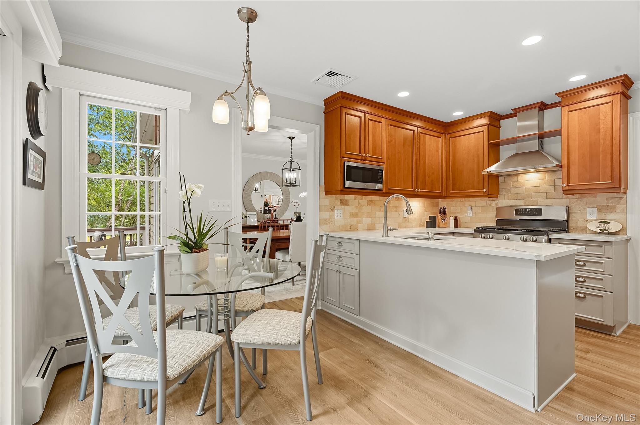 80 North Street Rye, NY 10580 - Photo 10 of 37 a kitchen with stainless steel appliances granite countertop a sink a stove a refrigerator cabinets and a dining table