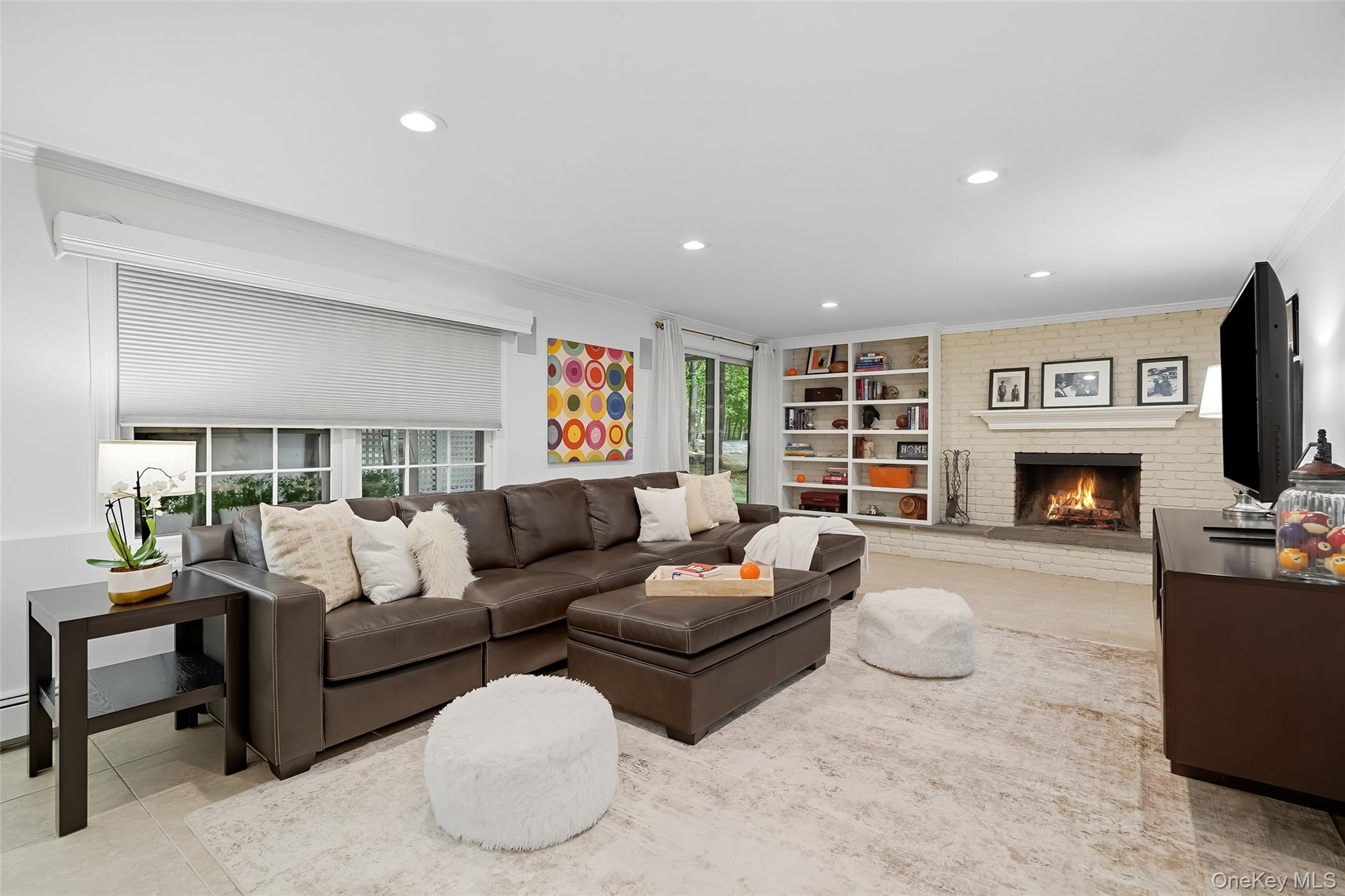 80 North Street Rye, NY 10580 - Photo 15 of 37 a living room with furniture a fireplace and a flat screen tv