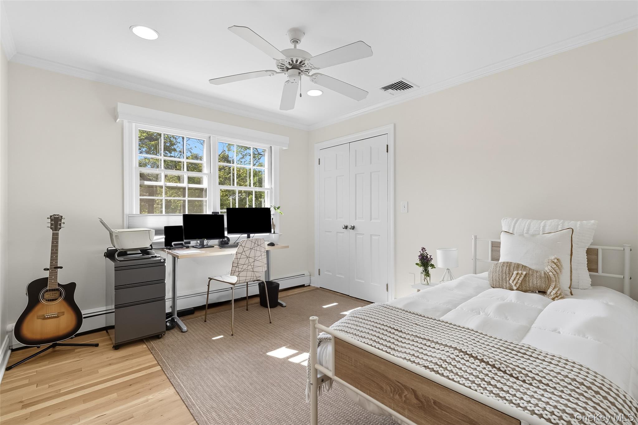 80 North Street Rye, NY 10580 - Photo 20 of 37 a bedroom with a bed and a chandelier