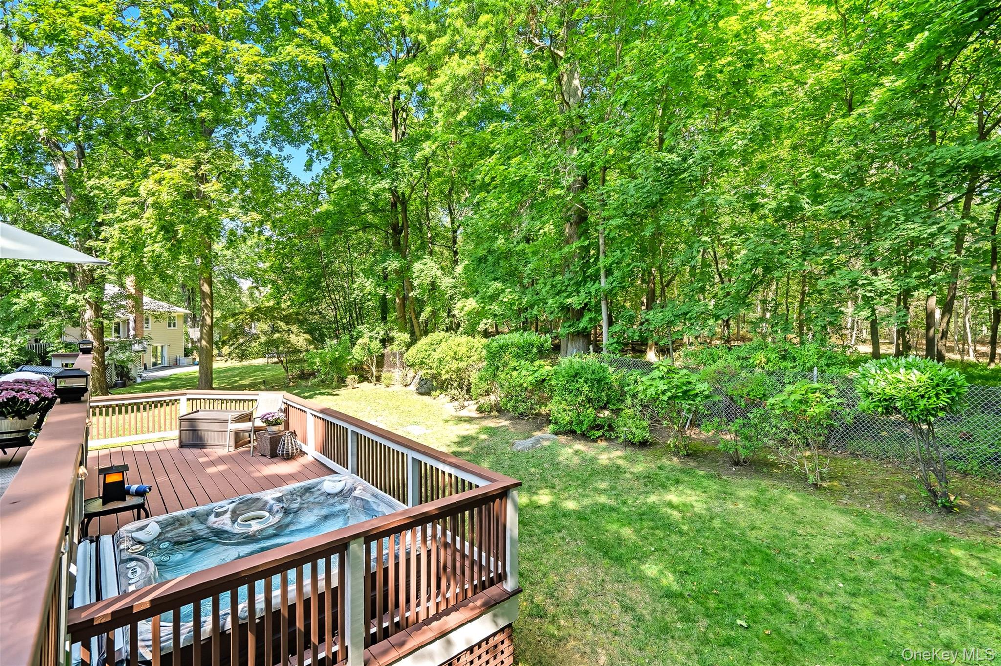 80 North Street Rye, NY 10580 - Photo 33 of 37 a view of a patio with table and chairs and wooden floor