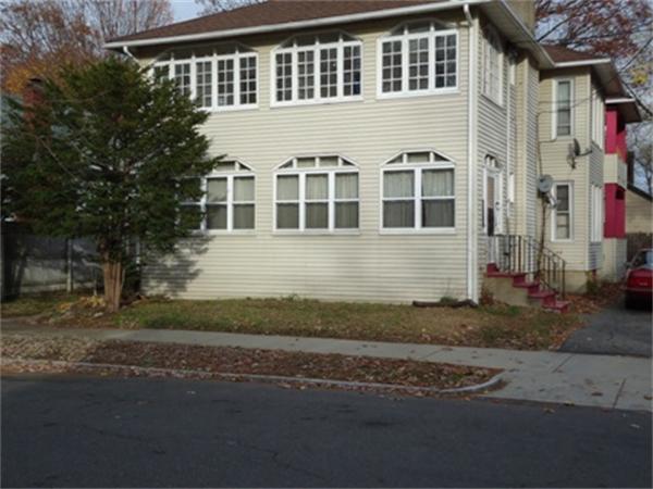 75-77 Marsden Street Springfield, MA 01109 - Photo 1 of 1 a front view of a house with a yard