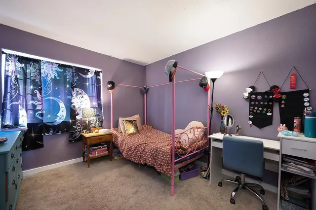 a bedroom with furniture and a bed