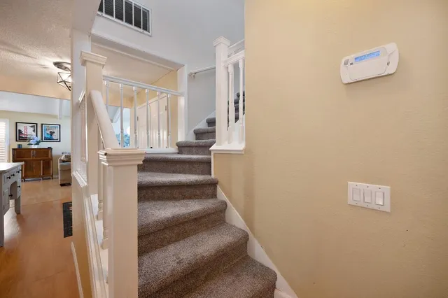 a view of staircase with white walls