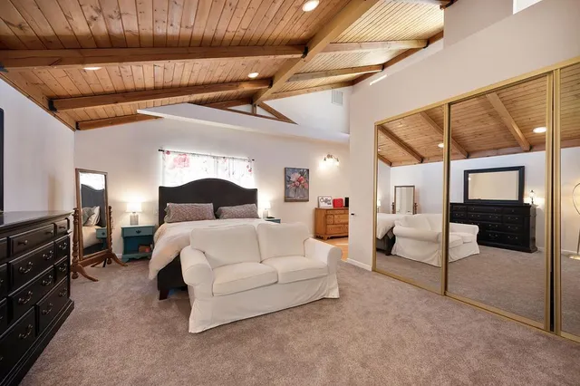 a living room with furniture and a ceiling fan