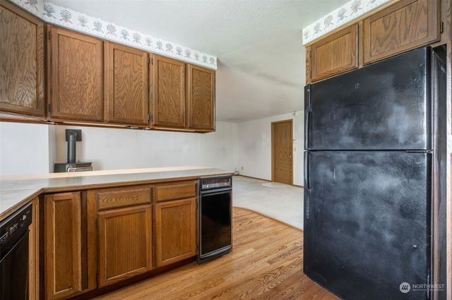 a kitchen with wooden cabinets and a sink