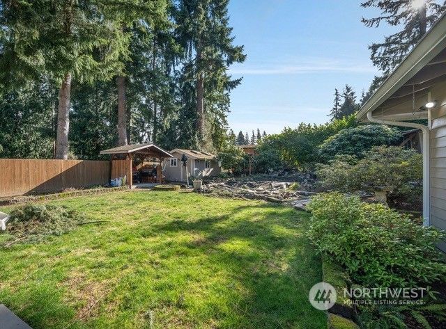 a view of a house with swimming pool and sitting area