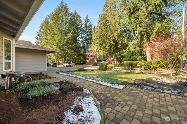 a view of backyard with swimming pool