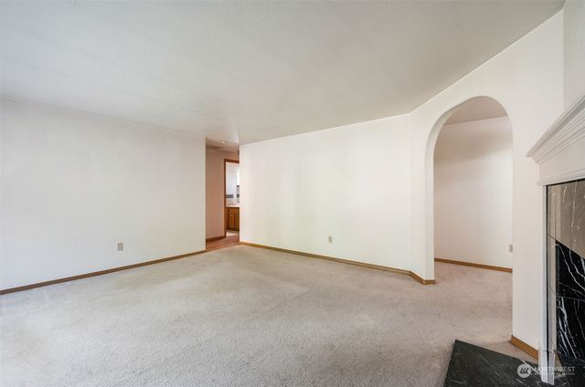 an empty room with a fireplace